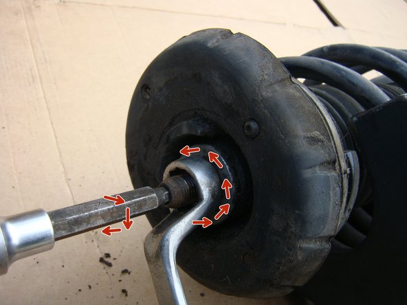 
Placer le compresse-ressort, release the stop nut then compress the spring until the pressure against the stop is released
