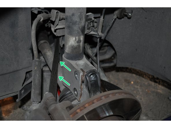 Déposer les vis et écarter le bas de l’amortisseur par rapport au moyeu.