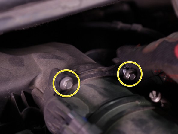 Retirer les deux vis du débitmètre