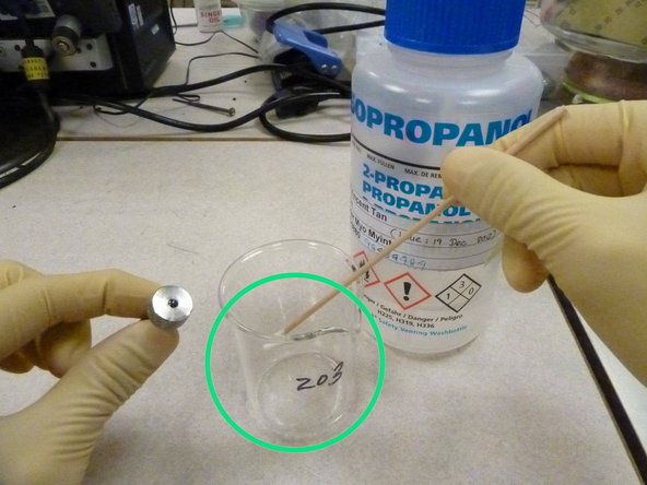 Tear open a new stick of Collection swab and dab it in acetone