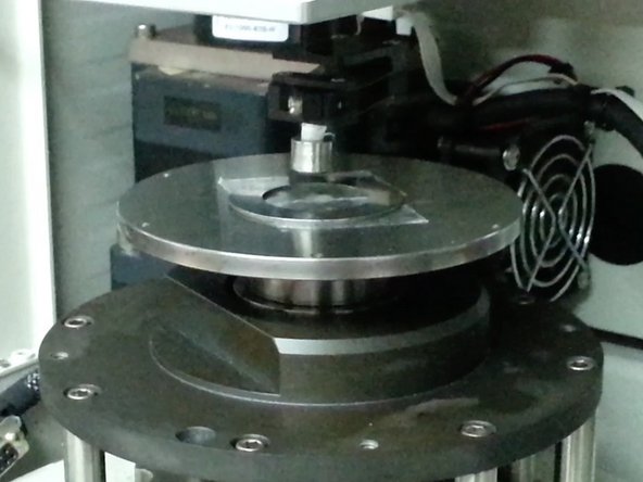 Move specimen holder further away from the disc, so as to allow easier removal of the specimen holder cap