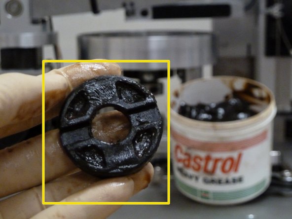 Using gloves, apply heavy grease sparingly on the middle piece