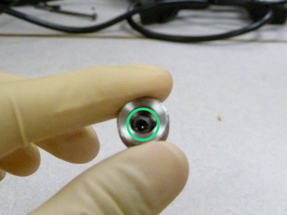 Unscrew the M12 bolt from the ball holder cap