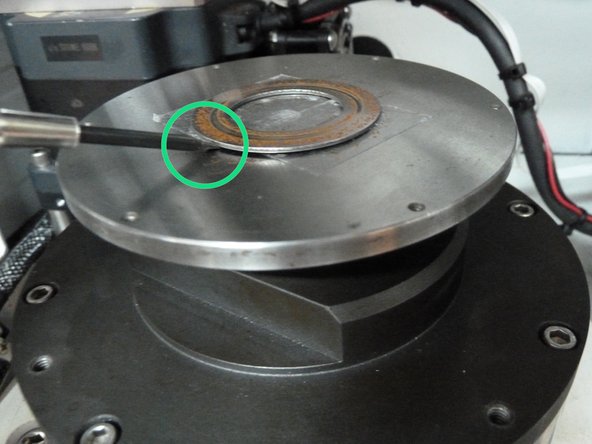 A screw driver acts as a lever at and helps remove the disc from the wear tester easily