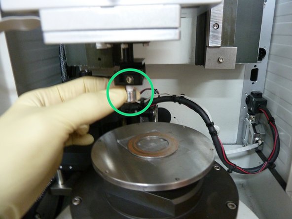 Unscrew and specimen holder cap, in a clockwise orientation