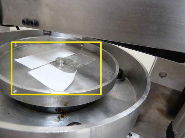 Secure the disc specimen to the disc-holder with strong double sided tapes