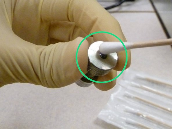 Clean the exposed surface of the ball specimen with the wet swab