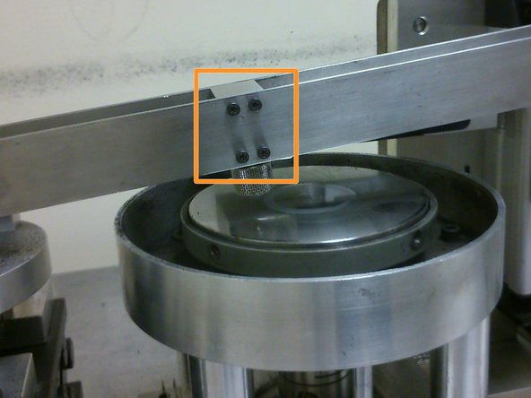 The sample holder can be secured onto the cantilever beam using eight M3 screws, with four on each side of the cantilever beam. However, only four screws on the side of the cantilever beam facing the user would be used as the other four may act as force concentrators on the load cell and cause inaccurate readings.