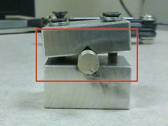 If the two halves are not parallel to each other (as shown in picture with red square), the sample holder would not be able to fit onto the cantilever beam.