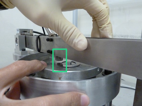 Hang the ball specimen slightly above the surface of the disc specimen