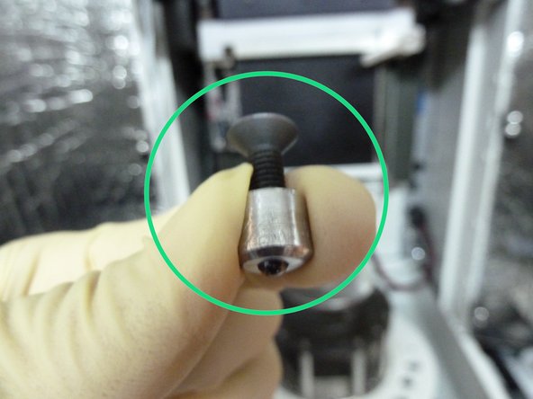 Screw in and tighten the specimen holder cap with a bolt to lock the specimen in its wear position