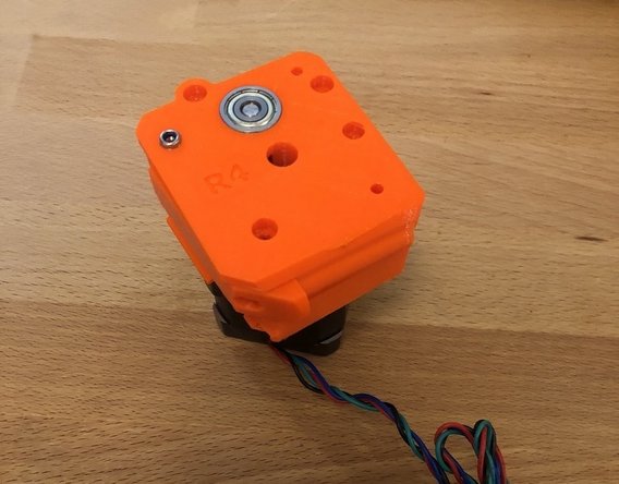 Add the extruder idler arm to the side of the extruder.