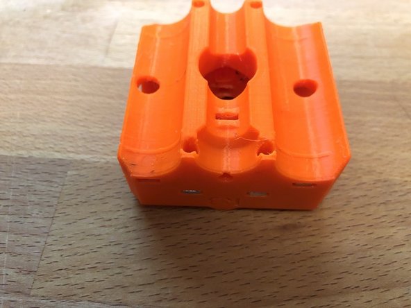 Insert 8 x M3nS in to the top and bottom of the z-carriage-front