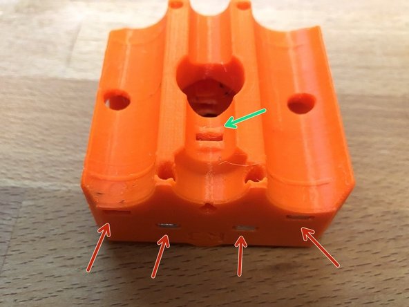 Insert 8 x M3nS in to the top and bottom of the z-carriage-front
