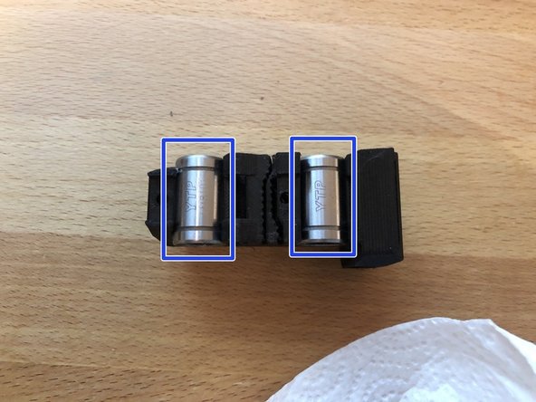 Insert 2 x LM8UU bearing into X carriage.