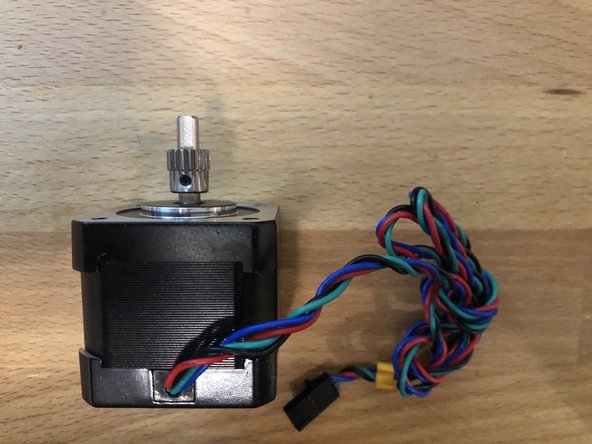 Add the small gear to the extruder.