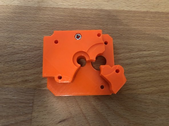 Add M3s nut to inside of the extruder rear.