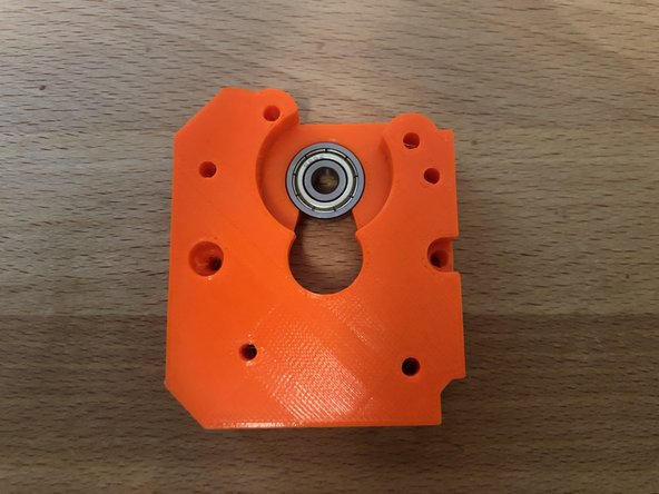 Insert 625z bearing into other side of extruder back (second picture).