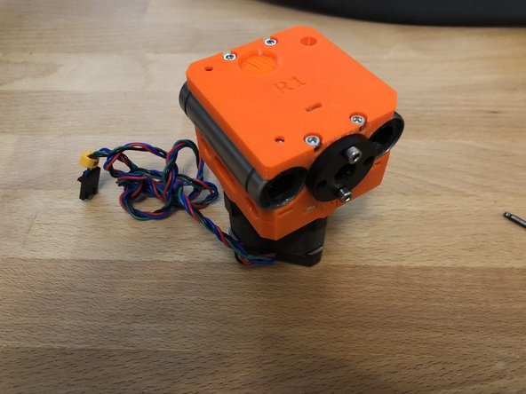 Using 2 x M3 20mm screws, attach the feed screw nut to the bottom of the z carriage assembly.