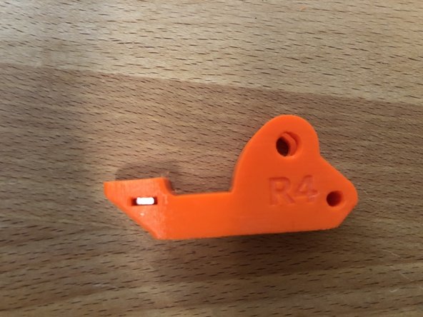 Insert M3sN nut into side of extruder idler.