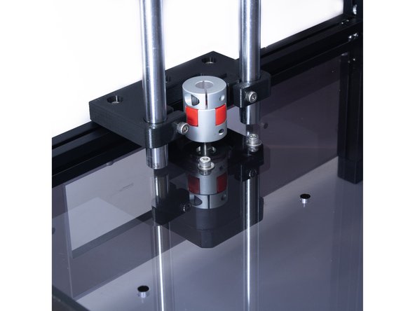 Slide the small side of the coupler on the stepper shaft and tighten the set screw on the bottom half.