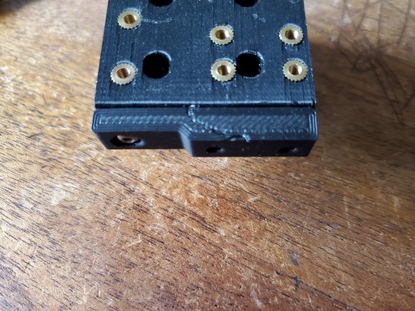 Attach the layer fan to the bottom of your Y carriage using a single M3 x 6mm button head bolt. (Image is shown off of a printer for clarity)