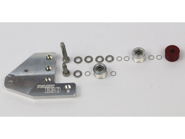 These photos can be used to validate the correct installation of the idler stacks on the front idler mount.