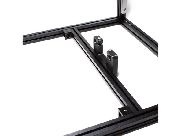 Attach both the left and right Z rod holder extrusions to the frame using the corner cubes and existing M3 nuts in the inside channels.  Note: use top M3 nut, the bottom one is left for spacing and ease of assembly.