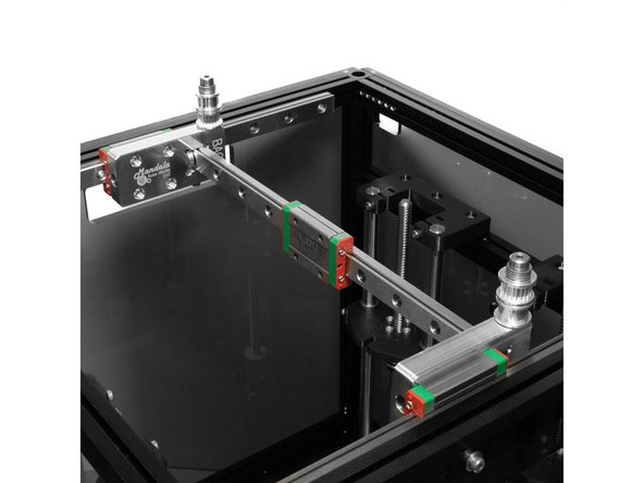 Attach the X carriages to the X rails using (4) M3 x 8mm Button head bolts each.