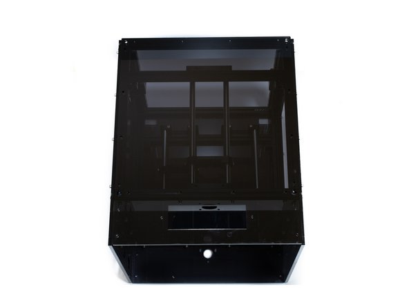 Using (16) M3 x 10 socket head screws and (16) M3 washers attach the left acrylic panel.