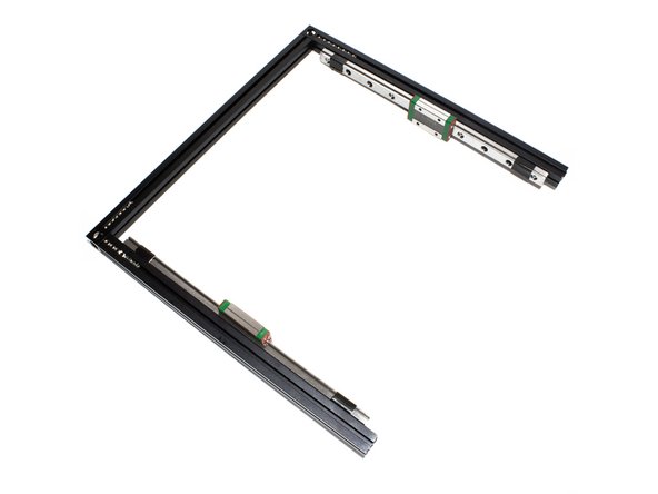 Attach each linear rail to top front and top back extrusions by sliding the M3 nuts into the inside channel on the extrusion.