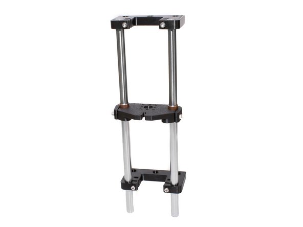 Attach a Z tower to the left side of the frame using (3) M3 x 10 socket head screws. Any spare M3 nuts should be towards the back of the frame.