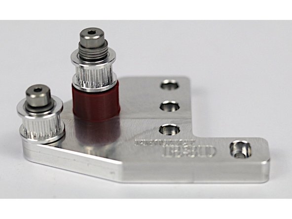 These photos can be used to validate the correct installation of the idler stacks on the front idler mount.