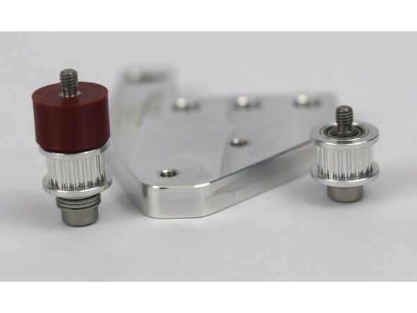 These photos can be used to validate the correct installation of the idler stacks on the front idler mount.