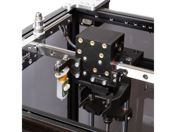 Attach the Y endstop mount to the bottom right two holes in the Y carriage using (2) M3 x 8mm socket head screws.