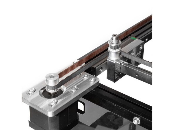 From the idler the belt should turn to the right and loop around the front stepper pulley.