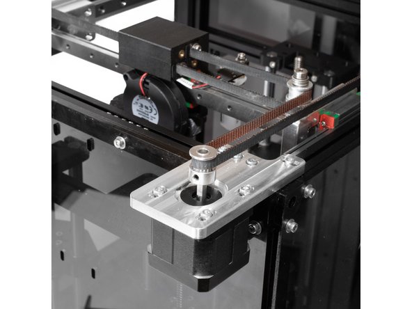From the rear idler mount the belt extends along the back of the printer, all the way to the rear stepper pulley.