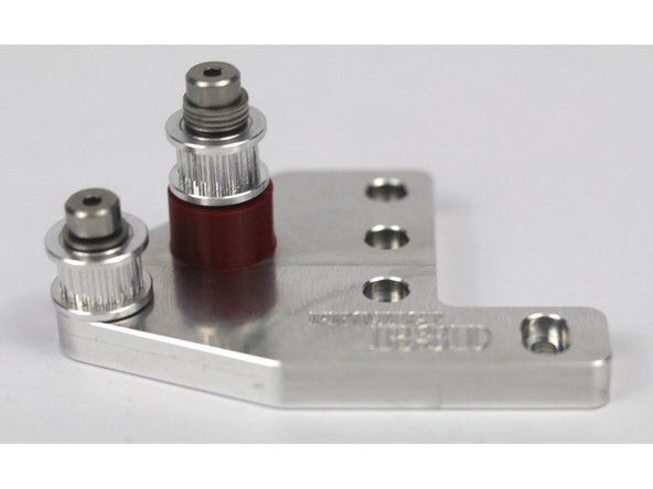 These photos can be used to validate the correct installation of the idler stacks on the front idler mount.