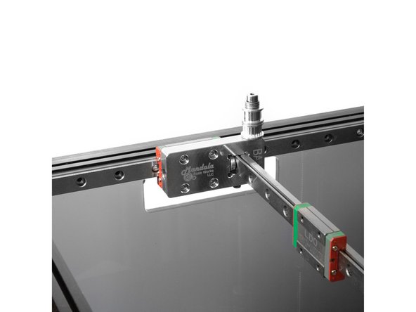 Attach the X carriages to the X rails using (4) M3 x 8mm Button head bolts each.
