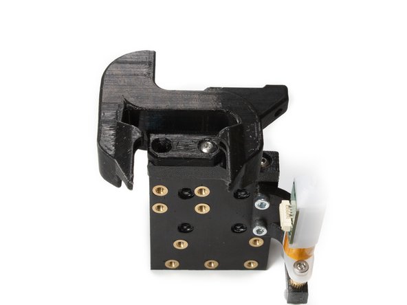 Attach the printed layer fan shroud to the adapter using (1) M3 x 8 button head screw into the hole that has the M3 nut you installed earlier.