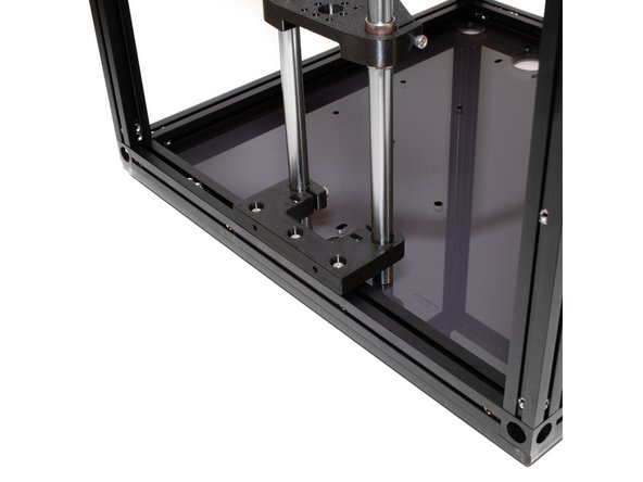 Smooth rods for all Z towers should be flush with the bottom acrylic panel.