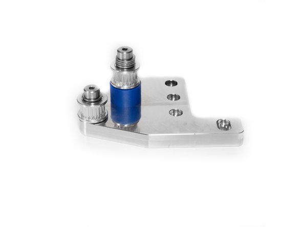 For the front idler, the stack for the outside bolt is the short stack. Turn a 12mm shoulder bolt upside down and install (1) M5 washer, then (1) M5 shim. Next add the 20T idler, then lastly (1) M5 shim.