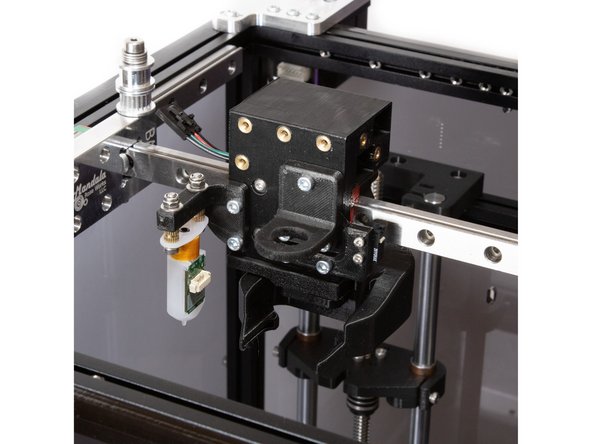 Attach the Revo Micro mount to the carriage using (3) M3 x 8 socket head screws.
