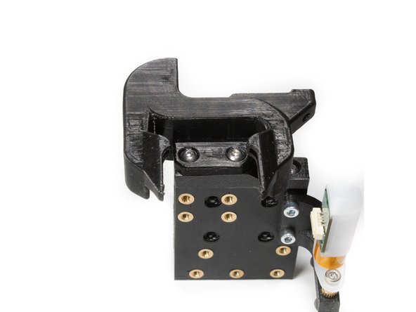 Insert (1) M3 x 12 button head screw in the remaining hole to finish installing the layer fan shroud.