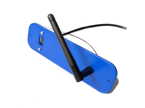 Using (2) M3 x 10 socket head screws, washers and nuts, attach the antenna and USB extender to the outside of the printer panels.