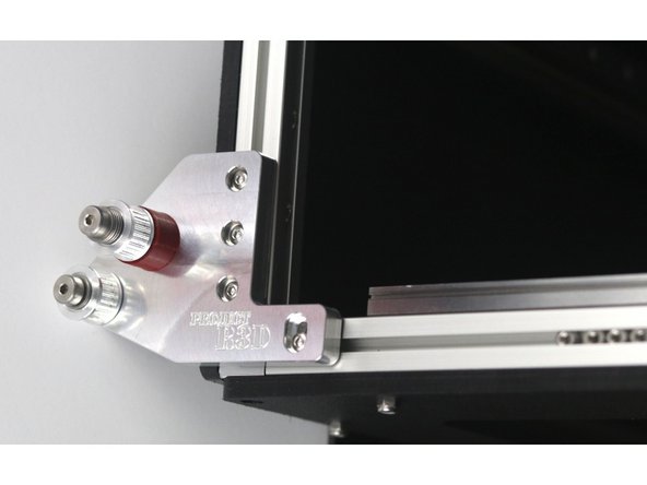 Attach the front idler mount to the left side of the top of the frame using (4) m3 x 8mm button head bolts.  Don't overtighten them - you'll need to be able to adjust the position of the idler mount to align the belts later.