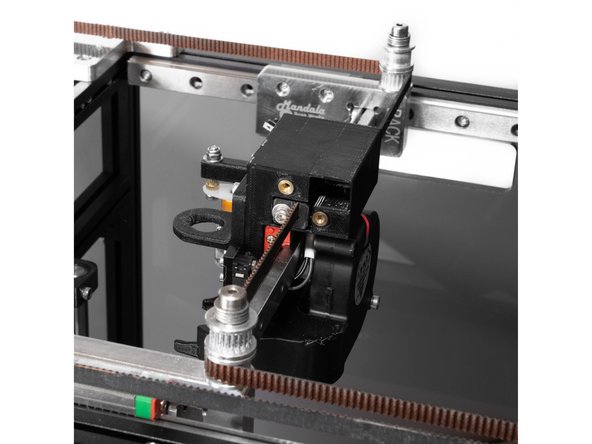 The lower belt should go from the Y carriage and then around the lower smooth idler on the front X carriage.