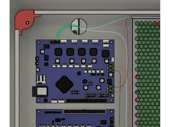 There are two cloth wrapped green wires for the hotend. The ends have crimped bootlace connectors.