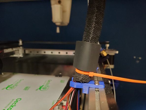 There is a 36&quot; zip tie inside the wiring bundle. One end of it slots into the wiring clip on the right side of the printer.