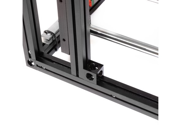 Using the existing M3 nuts in the inside extrusion channels, attach the corner cubes to the frame using M3 x 6 button head screws.